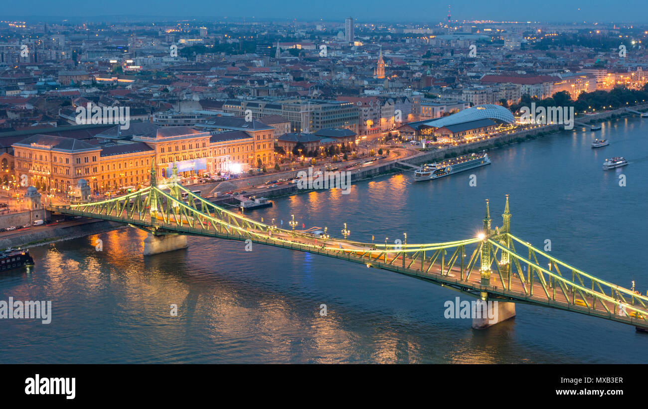 Budapest city at blue hour with illuminated Liberty bridge on Danube River, picturesque evening cityscape Stock Photo