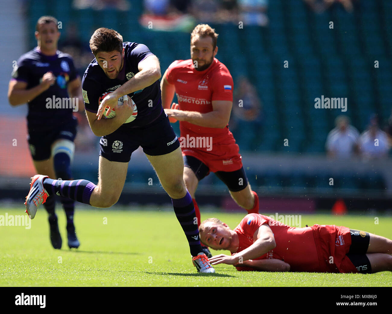 Scotland's Ally Miller breaks a tackle during day two of the HSBC London Sevens at Twickenham Stadium, London. Stock Photo