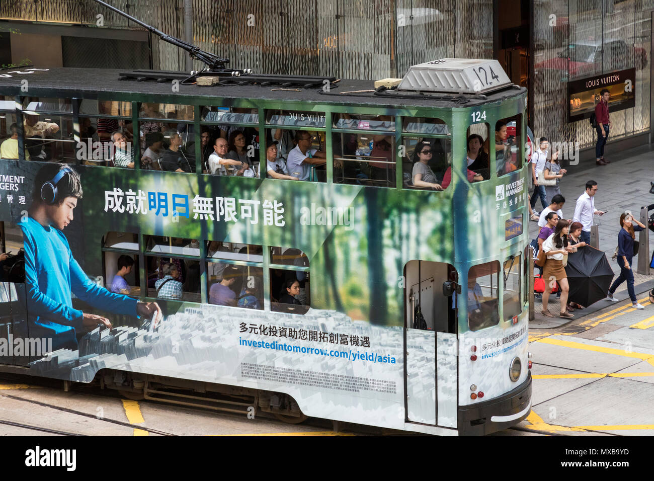 Tram and passengers in Central, Hong Kong, SAR, China Stock Photo