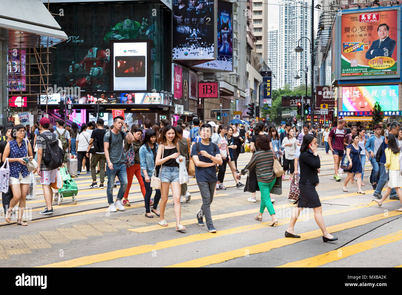 Pedestrians crossing the street at Causeway Bay, Hong Kong, SAR, China Stock Photo