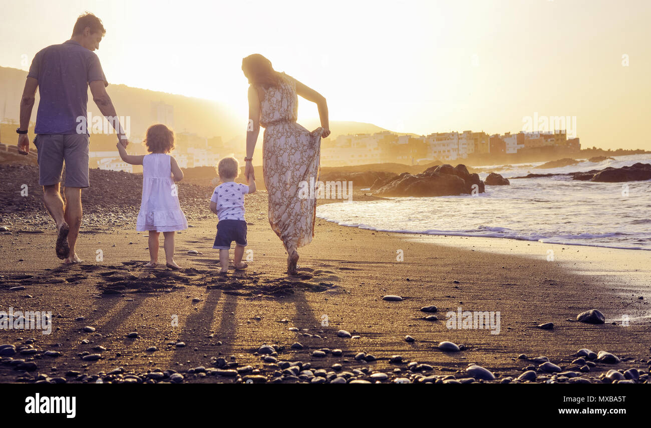 Family sunbathing beach hi-res stock photography and images - Alamy