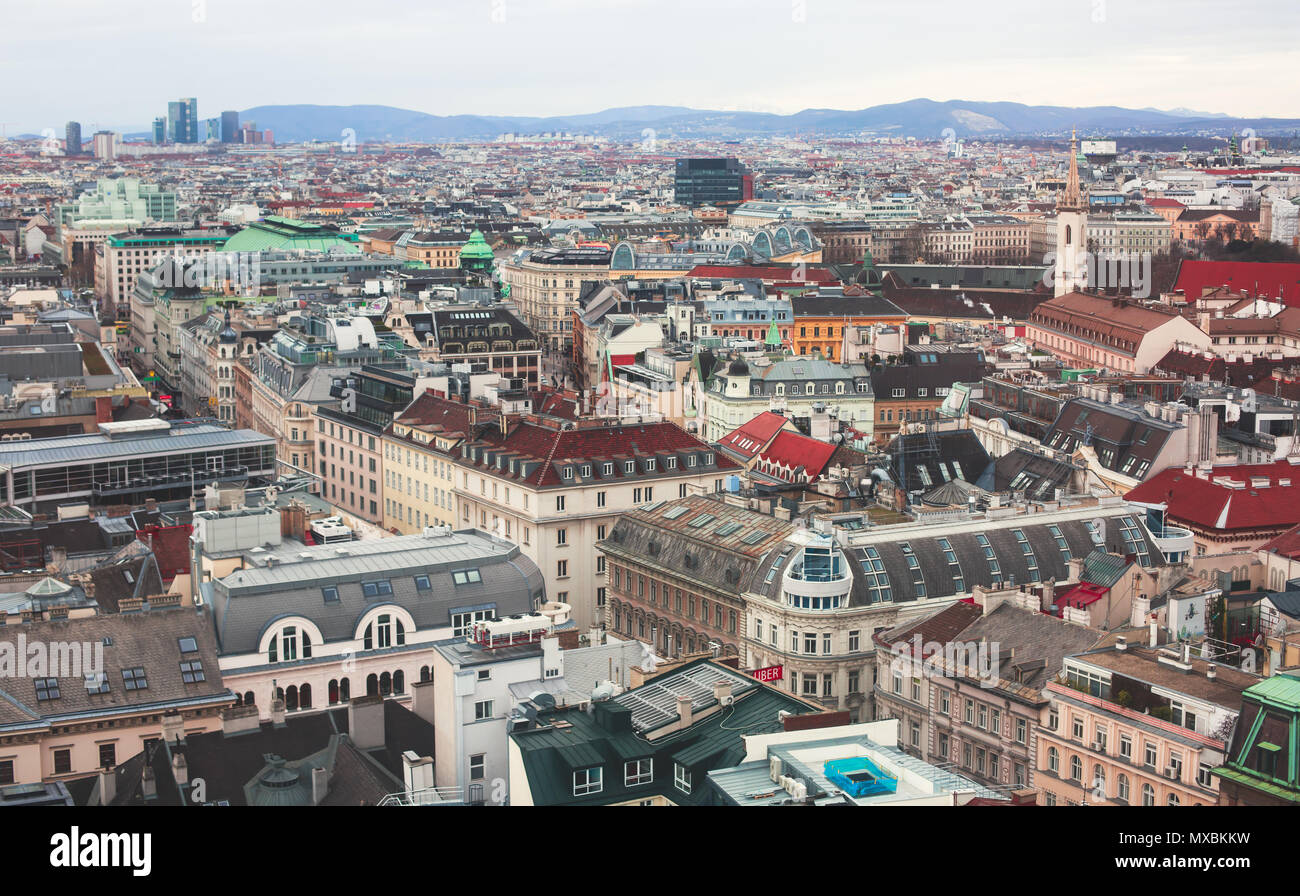 Beautiful super-wide angle aerial view of Vienna, Austria, with old town Historic Center and scenery beyond the city, shot from observation deck of Sa Stock Photo