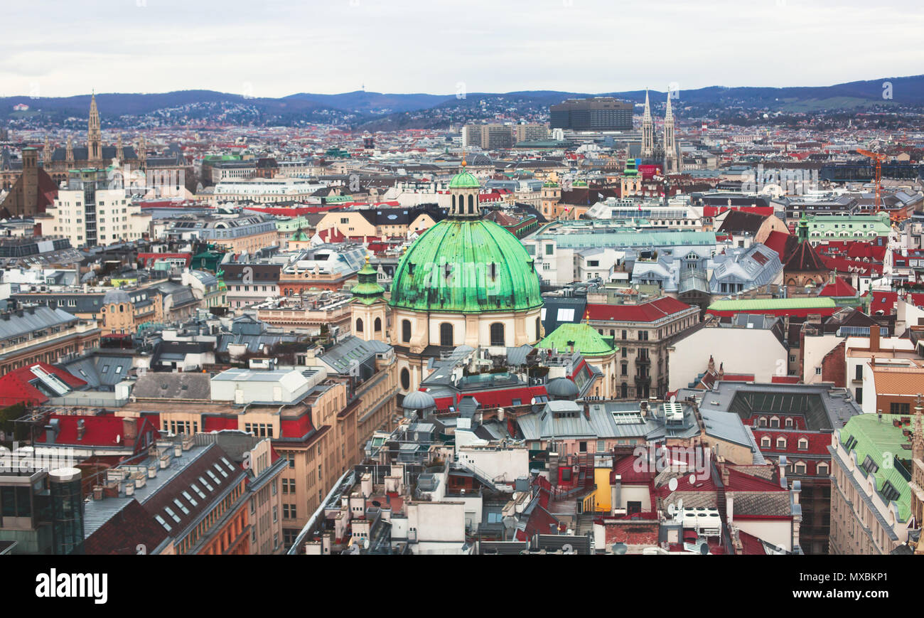 Beautiful super-wide angle aerial view of Vienna, Austria, with old town Historic Center and scenery beyond the city, shot from observation deck of Sa Stock Photo