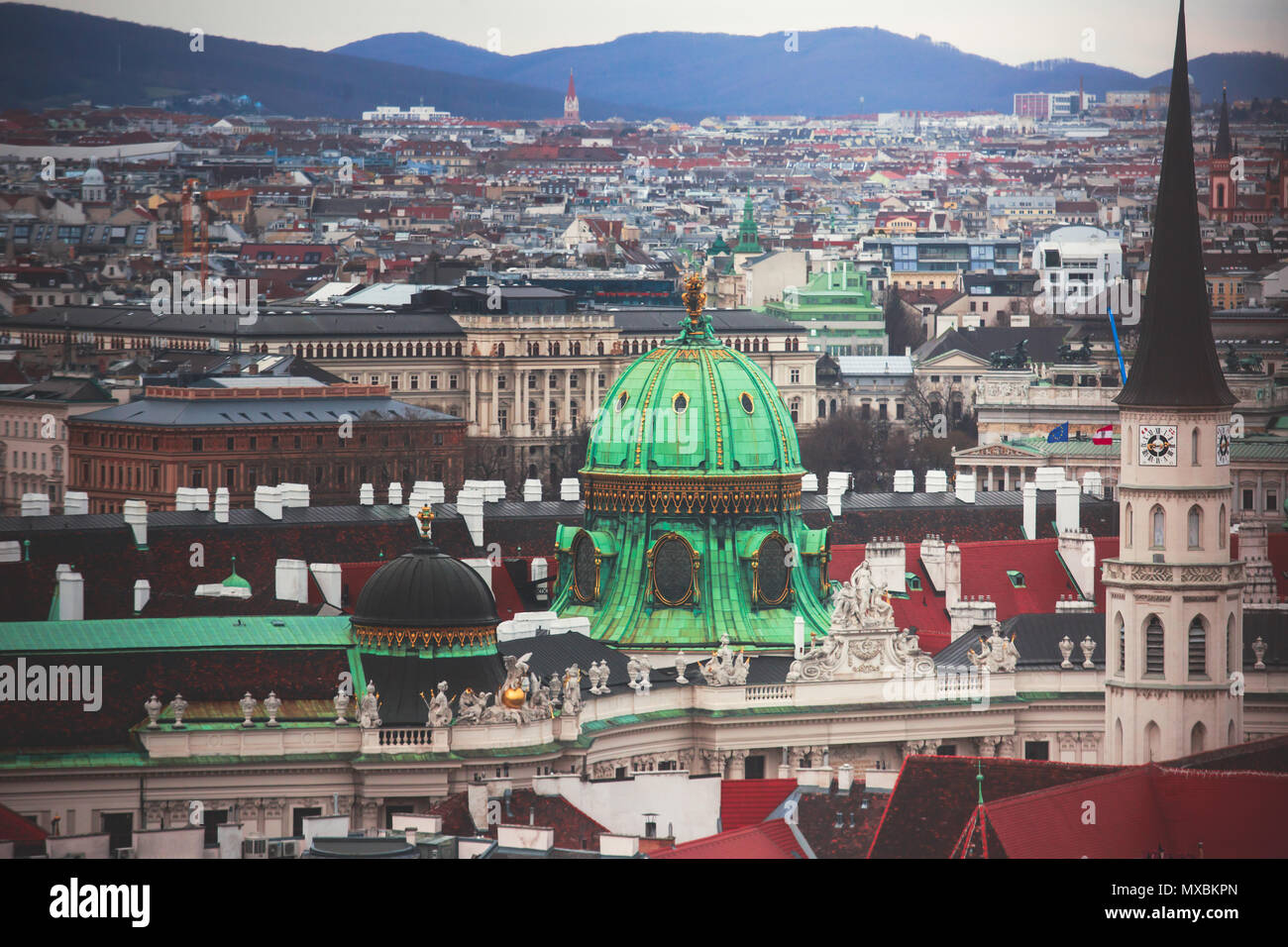 Beautiful super-wide angle aerial view of Vienna, Austria, with old town Historic Center and scenery beyond the city, shot from observation deck of Sa Stock Photo