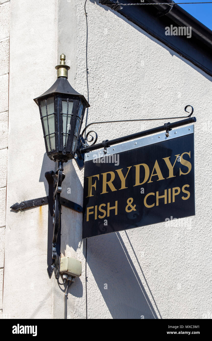 Frydays fish & chip sign above shop Stock Photo