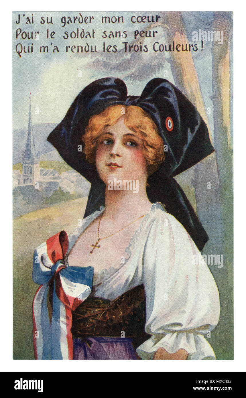 French historical postcard: Young beautiful redhead girl in a traditional dress, in a black cap with a tricolor. Alsace-Lorraine. France world war one Stock Photo