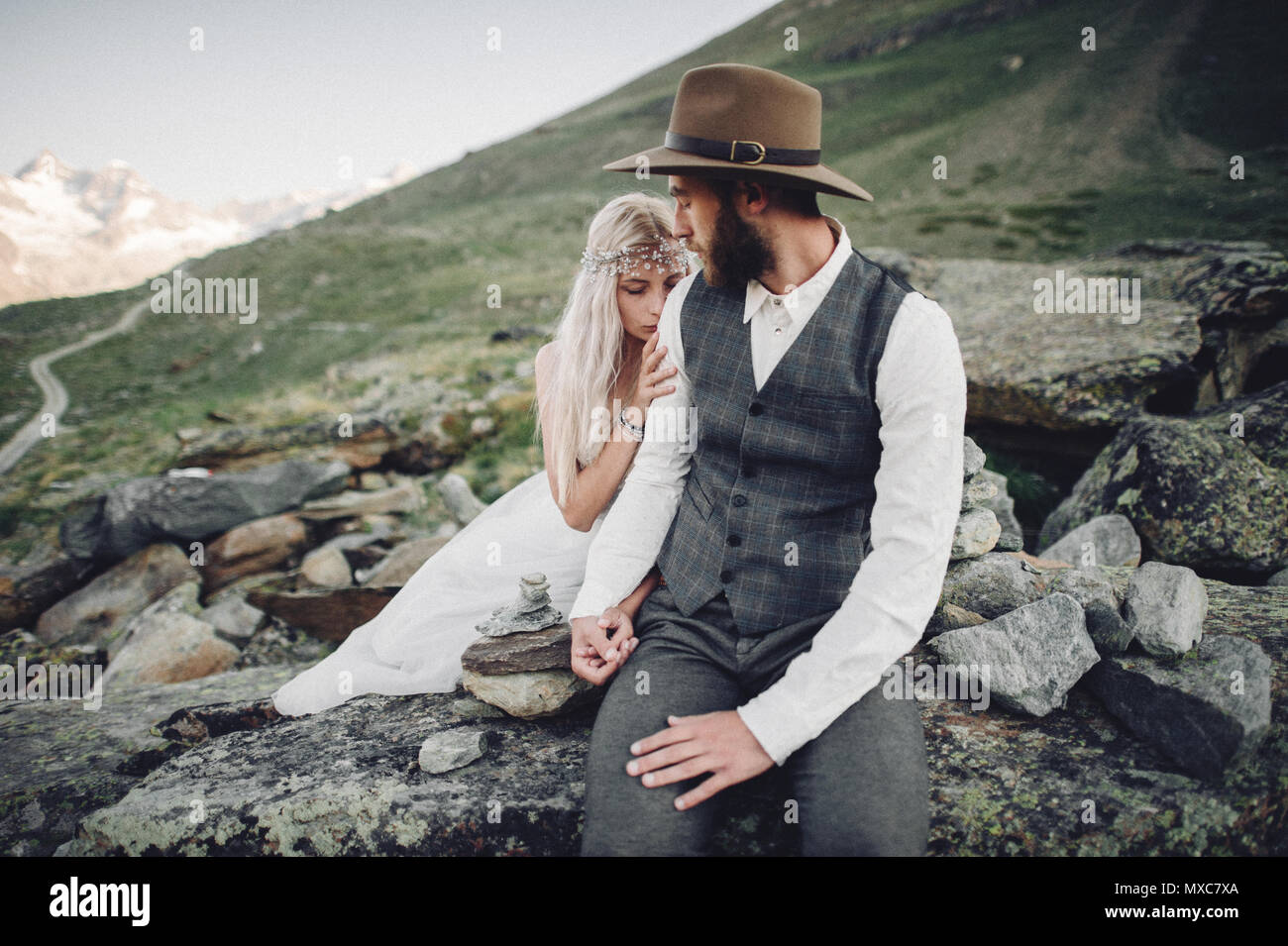 Stylish young wedding couple posing in beautiful Matterhorn moun Stock Photo