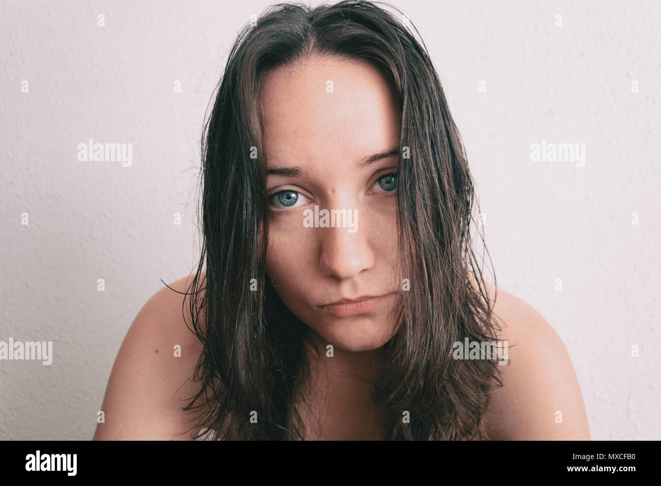 a girl with long hair and blue eyes looking at camera Stock Photo - Alamy