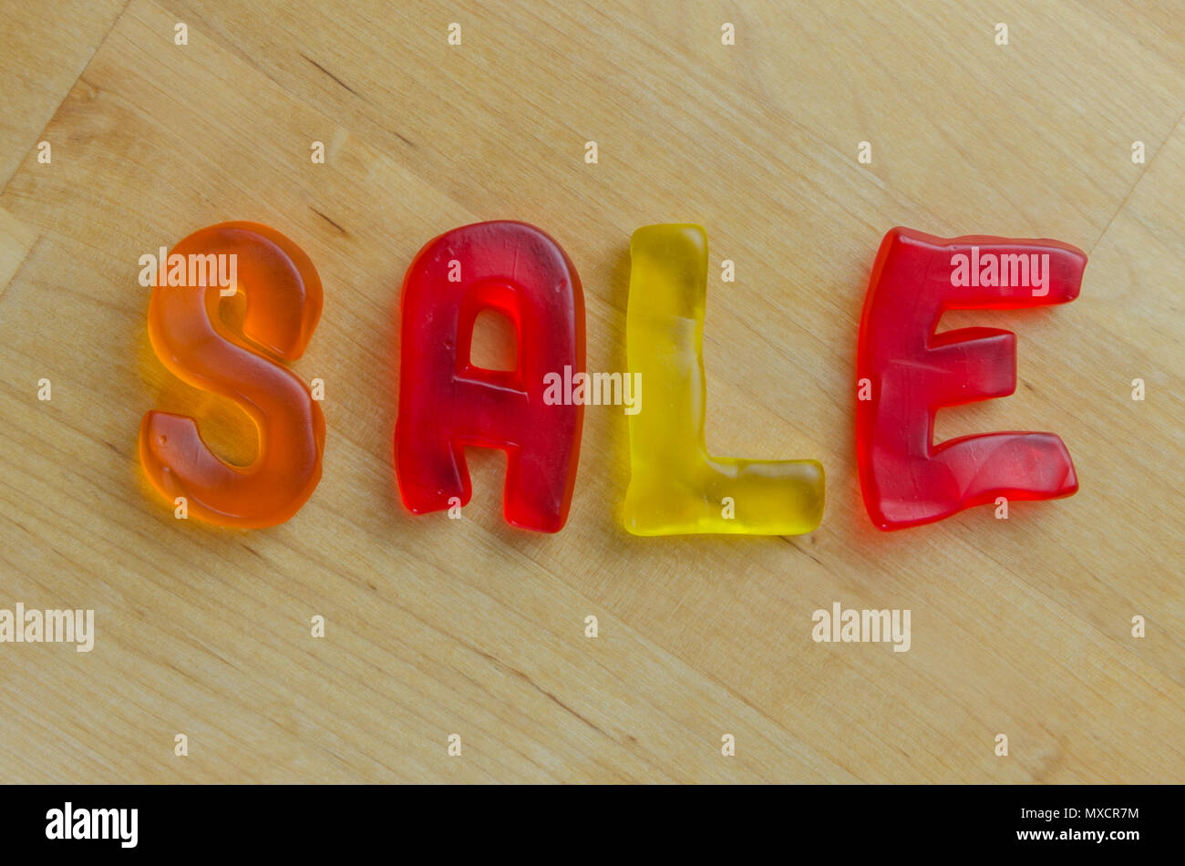 Colorful candy letters spell out the word sale stock photo alamy