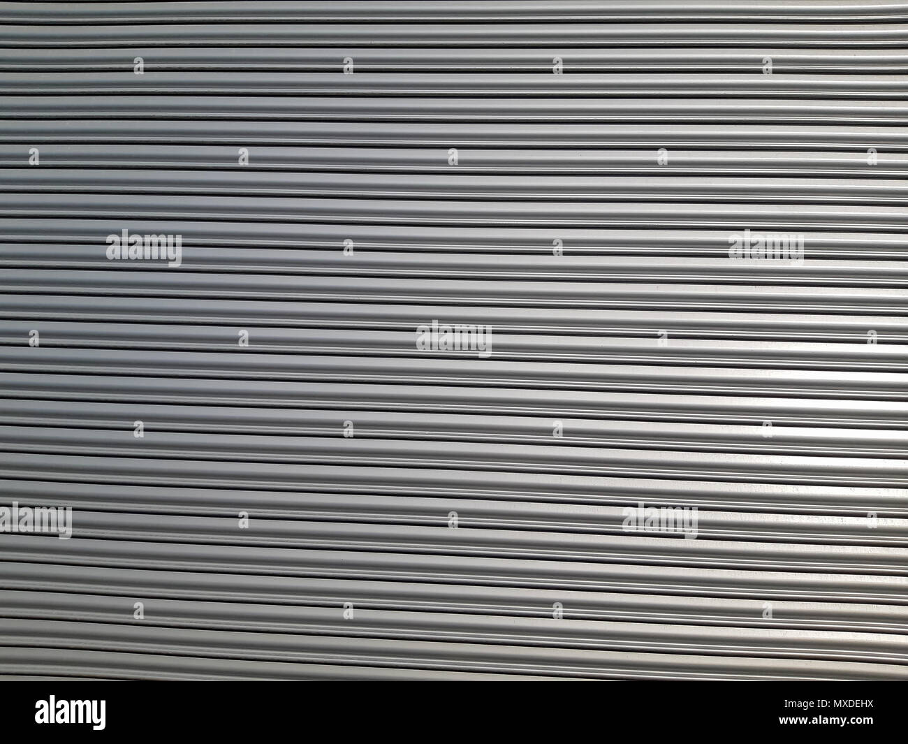 Old metal blinds painted with thick layer of light paint as background