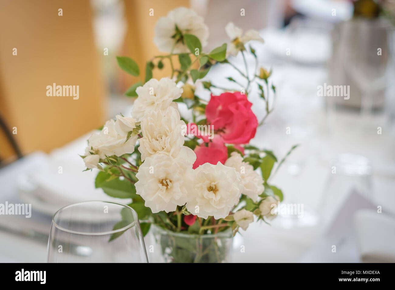 flowers on dinner table - flower decoration Stock Photo