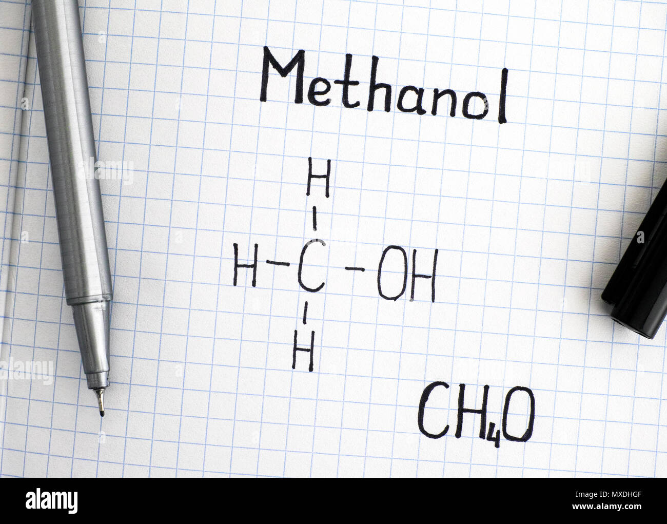 Chemical formula of Methanol with black pen. Closeup. Stock Photo