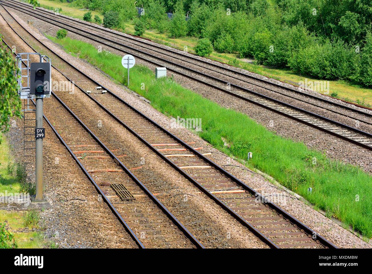 Empty railway lines and green aspect signal Stock Photo