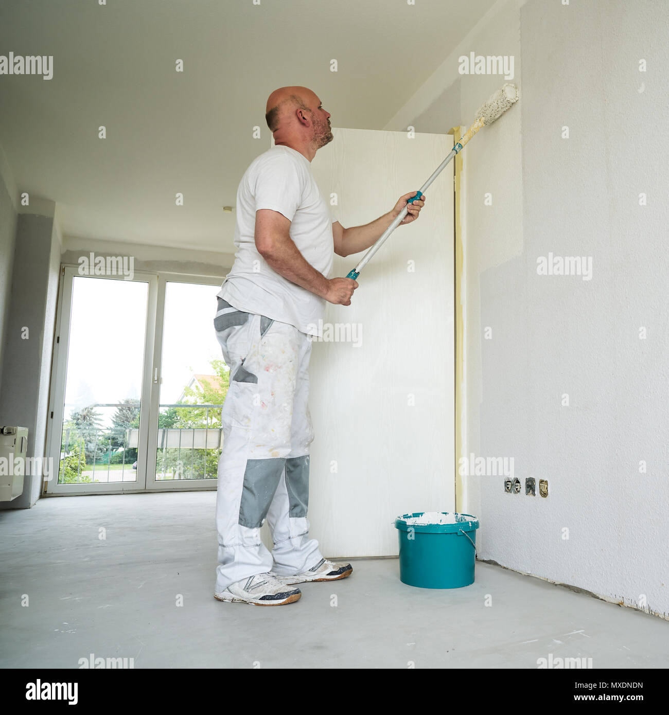 Craftsman renovating an apartment Stock Photo