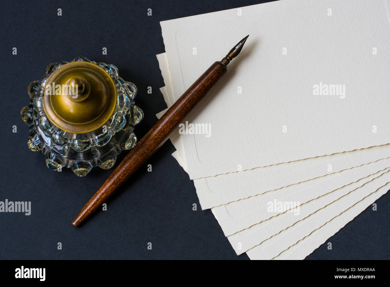Fountain pen, inkwell, papers on a black textured Stock Photo Alamy