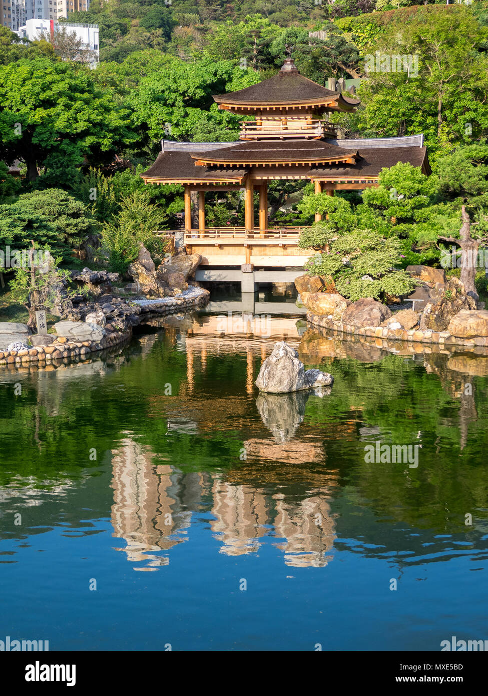 Lake and chinese temple in Nan Lian Garden of Hong Kong Stock Photo