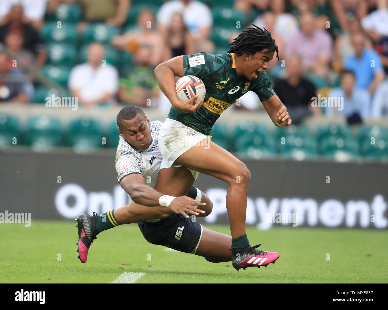 South Africa's Stedman Gans breaks through to score a try against Fiji during day two of the HSBC London Sevens at Twickenham Stadium, London. Stock Photo