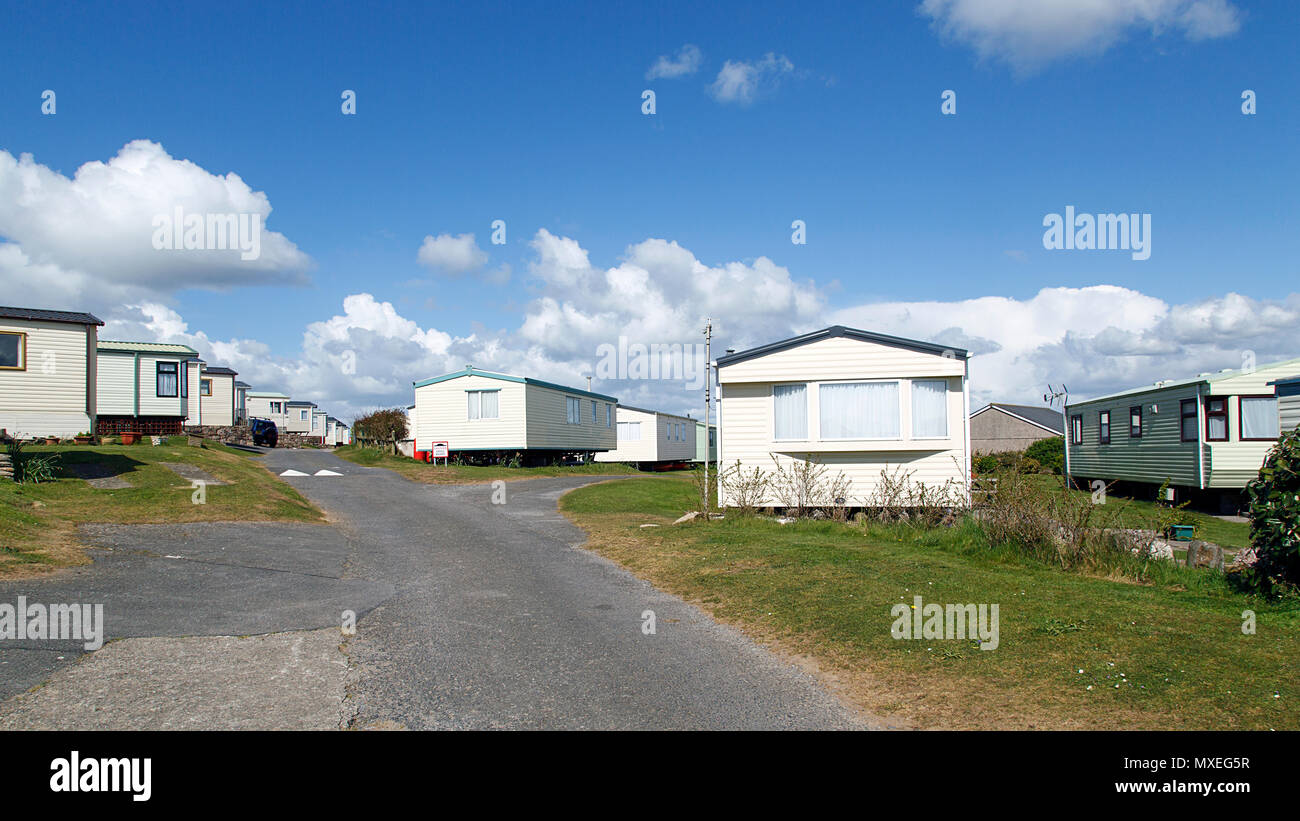 Broughton Farm Caravan Park - static caravans in Gower with a panoramic format and a blue sky background. Stock Photo