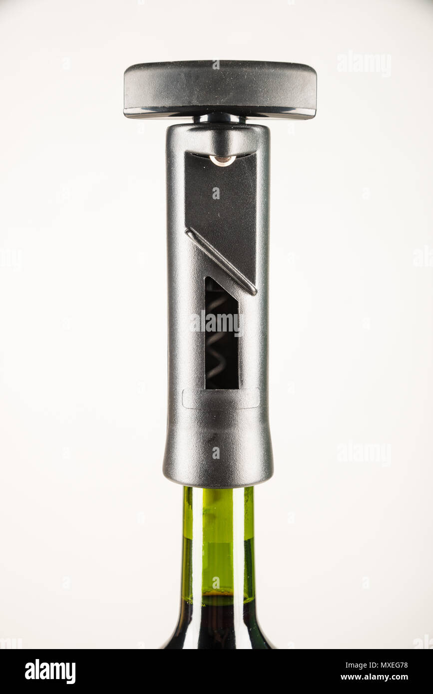 Modern cork screw on top of wine bottle Stock Photo Alamy