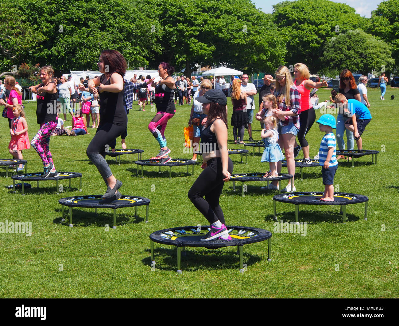 A group of people undertake bouncercise at Portsmouth fitness festival 2017 Stock Photo