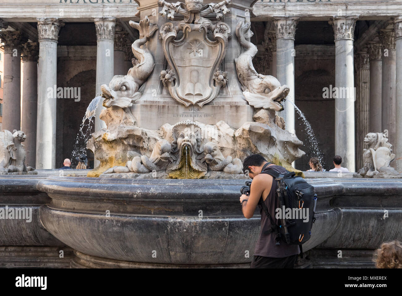 Rome Pantheon, Piazza della Rotonda tourist record a video at engraving on fountain Stock Photo