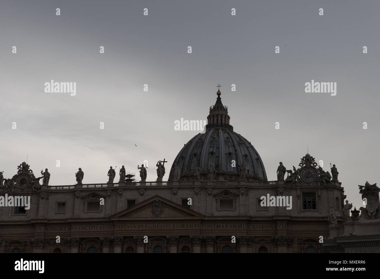 Rome Vatican city, silhouettes of statues on top of edifice in a grey