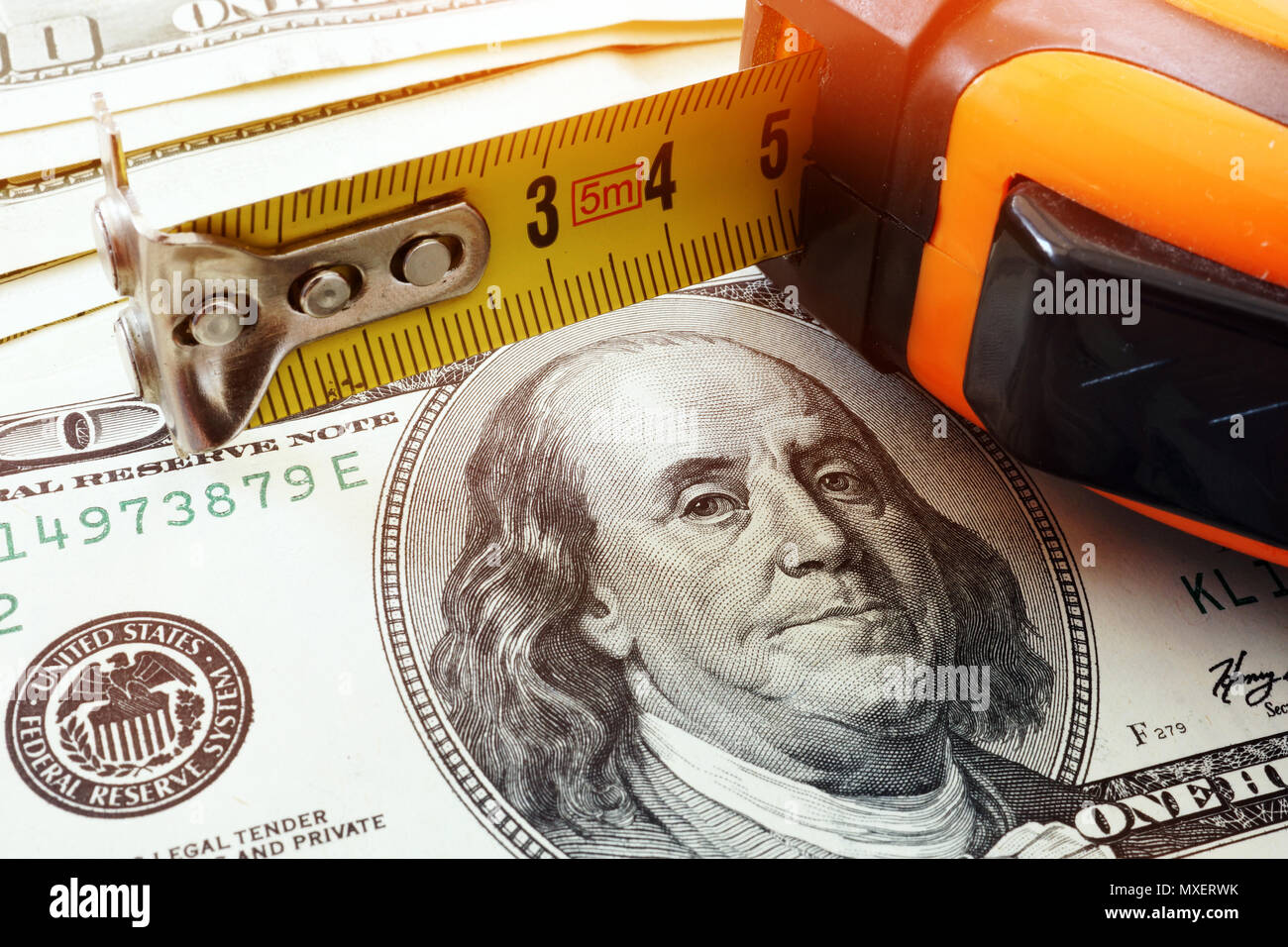 Renovation cost. Dollars and construction roulette Stock Photo