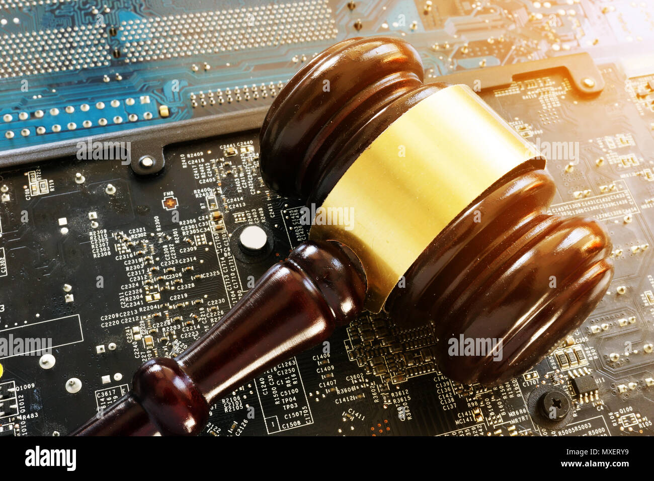 Gavel and electronic devices. Regulation of blockchain. Stock Photo