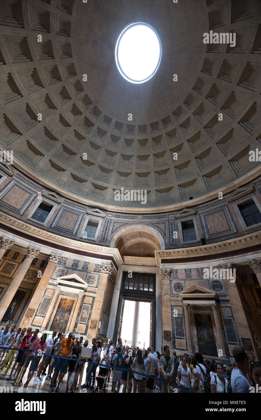 Rome Pantheon interior, light true the hole on dome, tourists visiting Stock Photo
