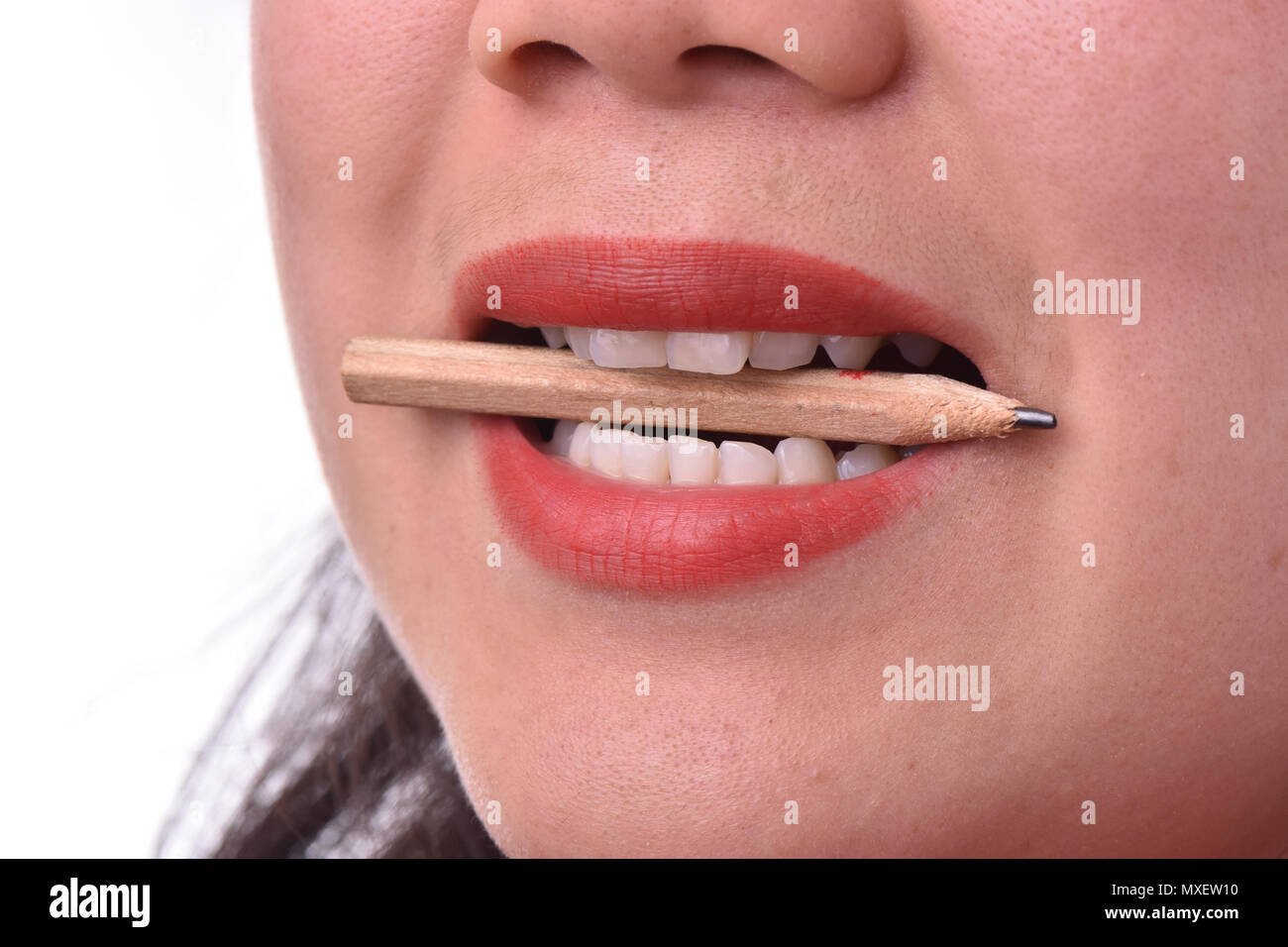 Angry woman biting pencil hires stock photography and images Alamy
