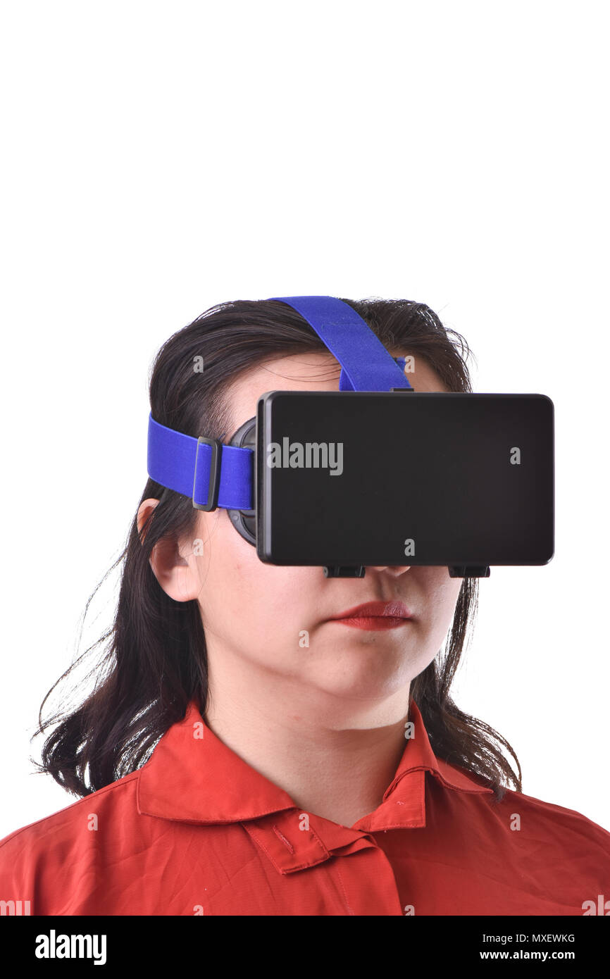Young woman playing with visual reality glasses on white background. Stock Photo