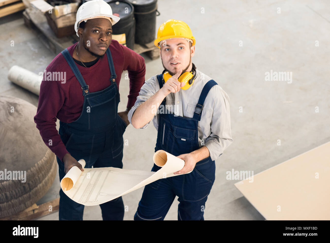 Young Technicians Wrapped up in Discussion Stock Photo