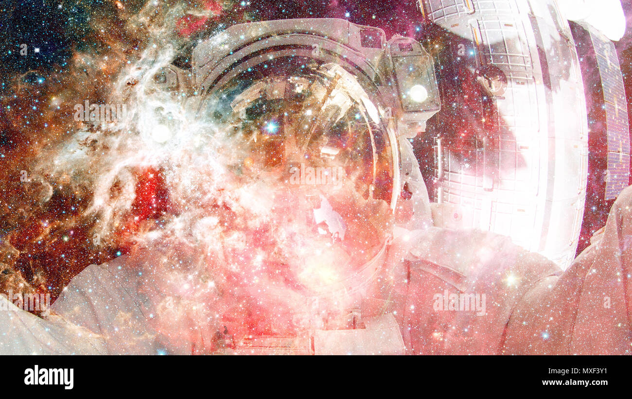 Astronaut in outer space. Science fiction art. Elements of this image furnished by NASA. Stock Photo