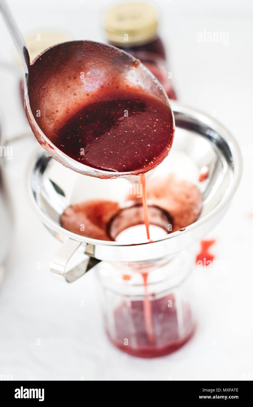 Preparing marmalade at home. Fresh red fruits from own garden or farmer