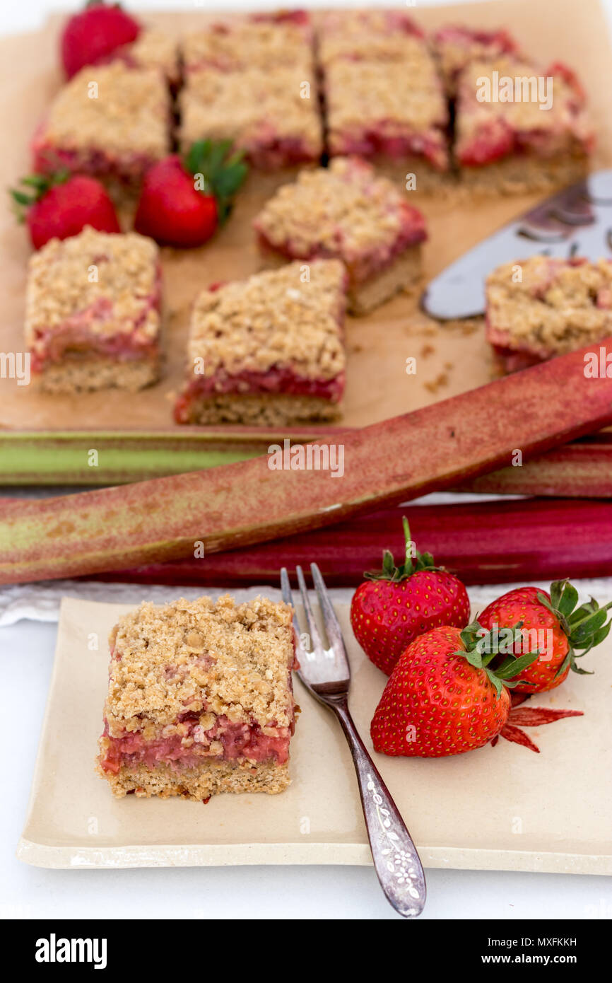 Healthy slices of red summer fruits bars served on a handmade ceramic