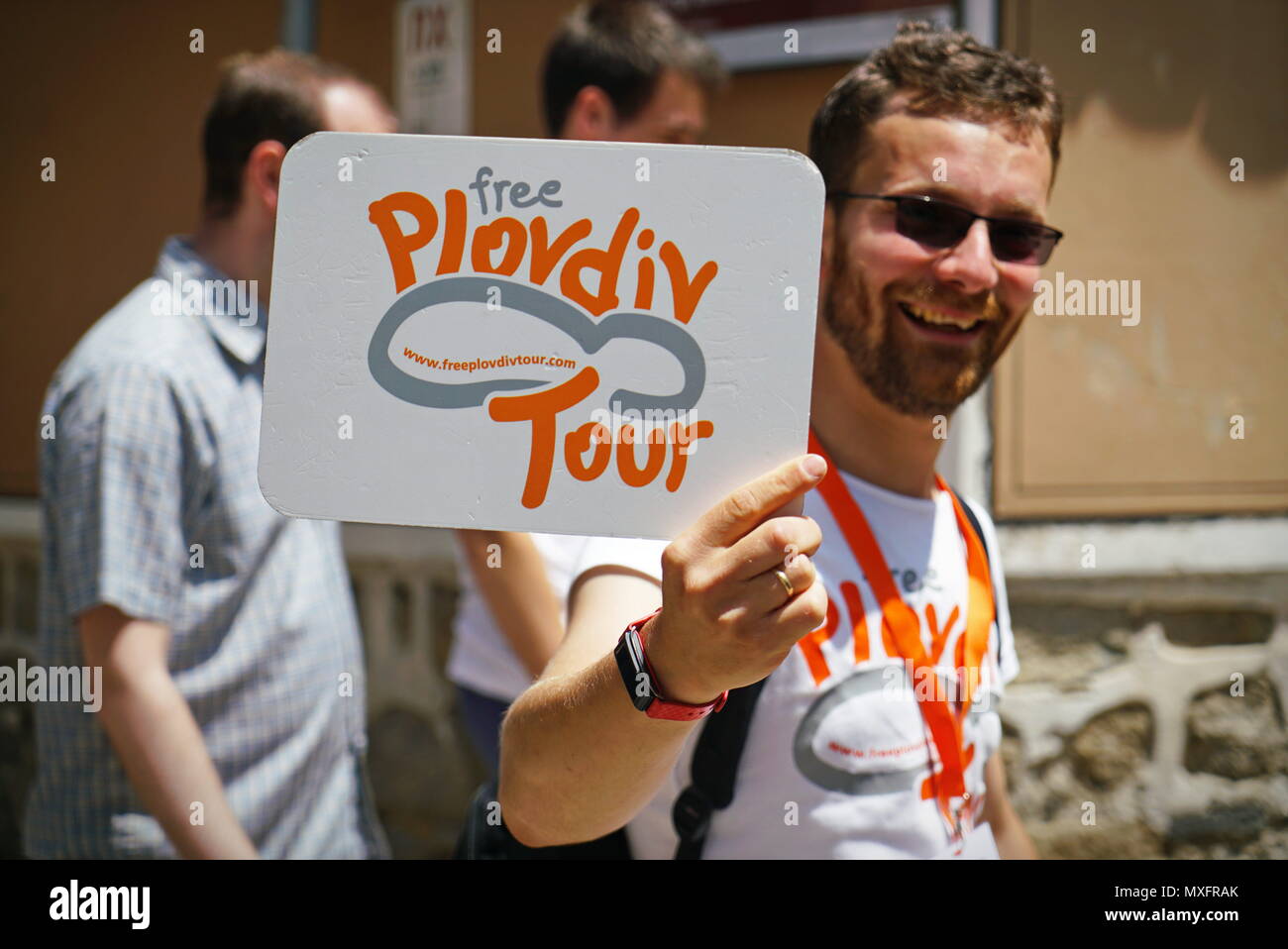 Plovdiv, Bulgaria - May 20, 2018: A tour guide with free tours sign in the historical city of Plovdiv Stock Photo