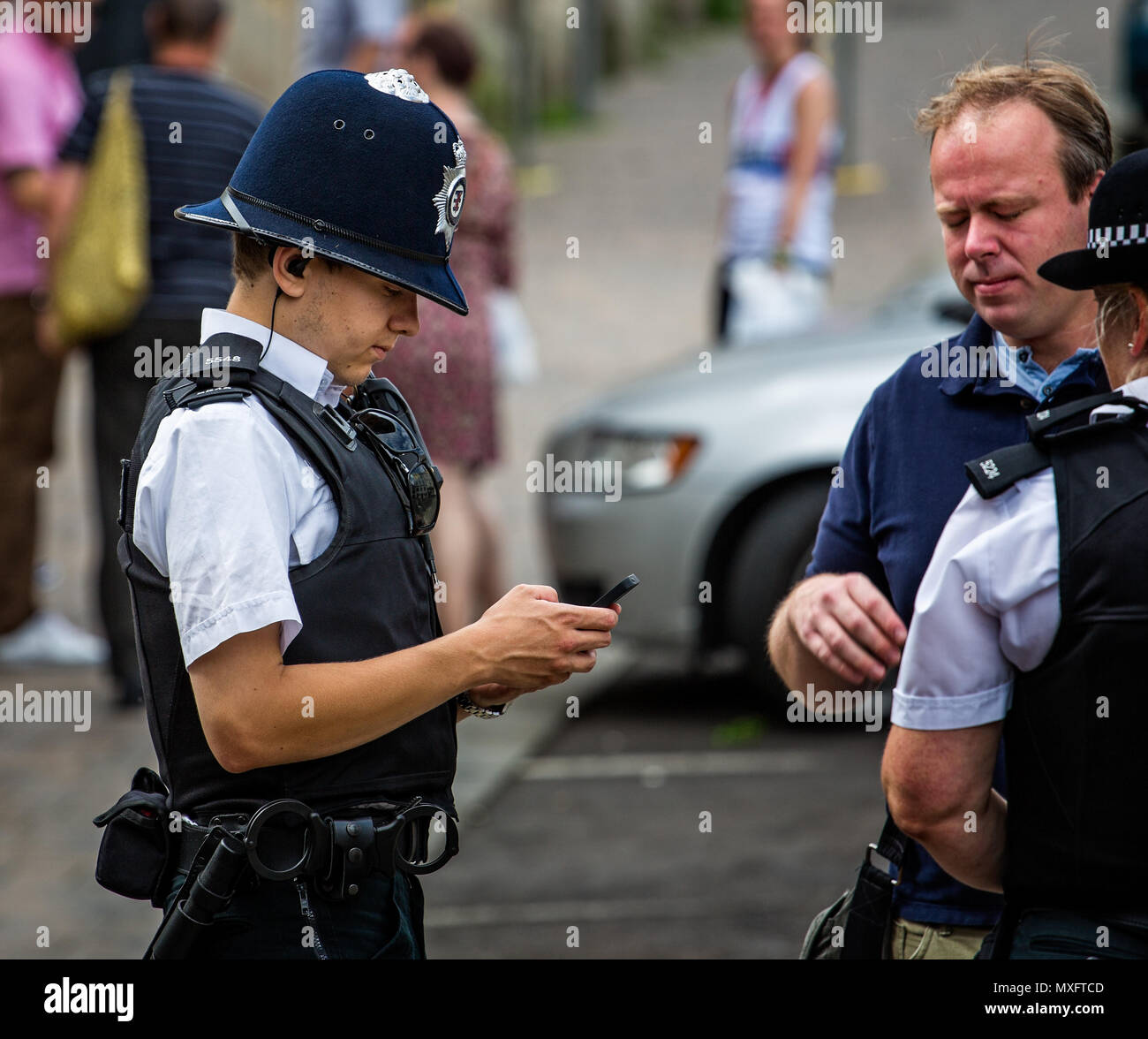 Young policeman photographed in Frome, Somerset, UK on 20 July 2014 Stock Photo