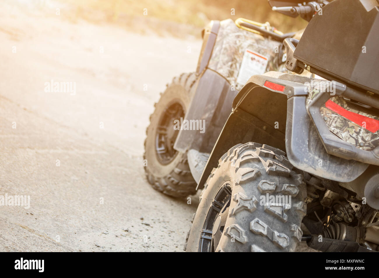 Atv Rear View Close-up tail view of ATV quad bike. Dirty whell of AWD all-terrain ...