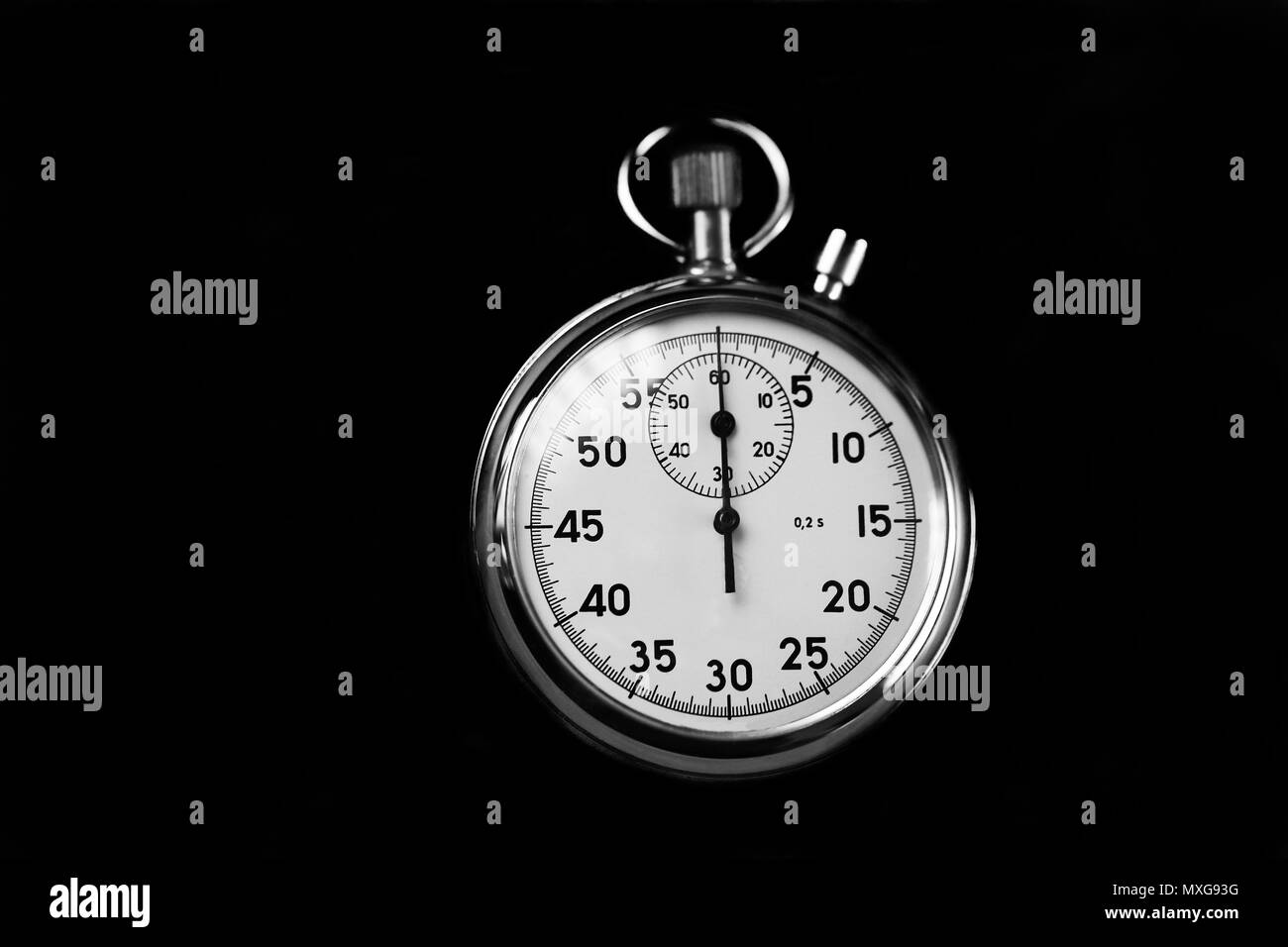 Old stopwatch isolated on black background top view. Concept of business time black and white Stock Photo