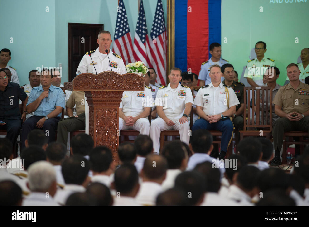 U.S. Navy Capt., Commander Task Force 75, delivers remarks during the ...