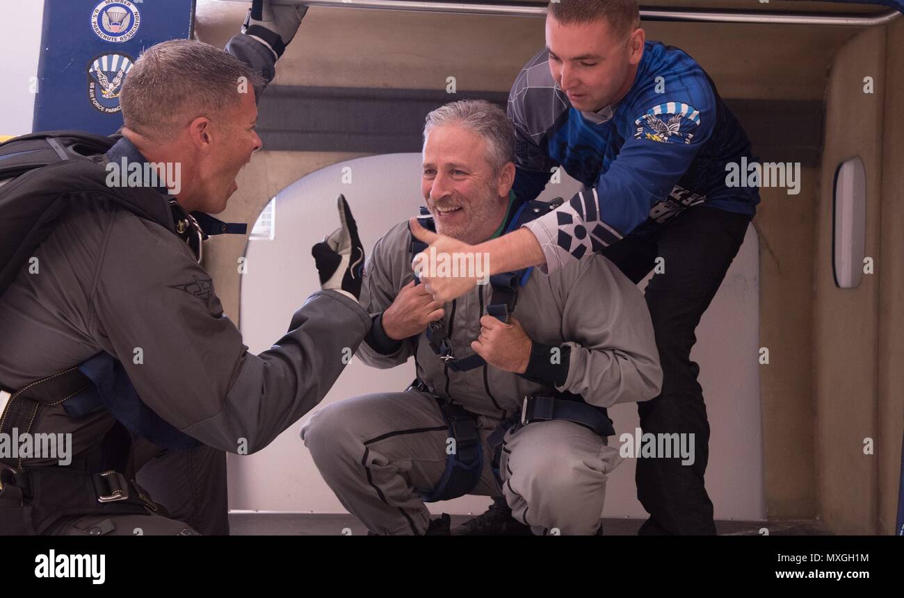 Comedian Jon Stewart practices aircraft exit with his instructor Air Force MSgt. Joshua Pickering, left, before taking a tandem skydive at the U.S. Air Force Academy June 2, 2018 in Colorado Springs, Colorado. Stewart is hosting the annual Warrior Games being held at the Academy. Stock Photo