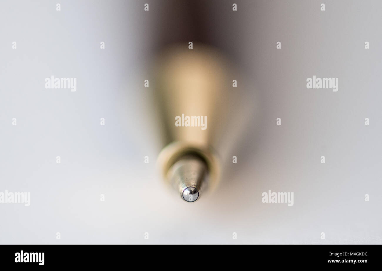 01 June 2018, Germany, Berlin A ballpoint pen lies on a piece of paper