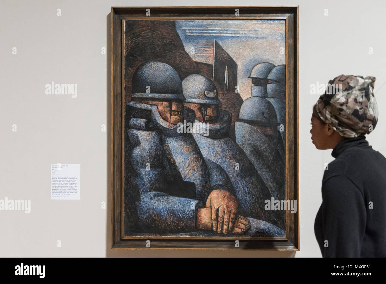 London, UK. 4 June 2018. A gallery staff member views "War, La Guerre",  1925, by Marcel Gromaire at a preview of "Aftermath: Art in the wake of  World War One" at Tate