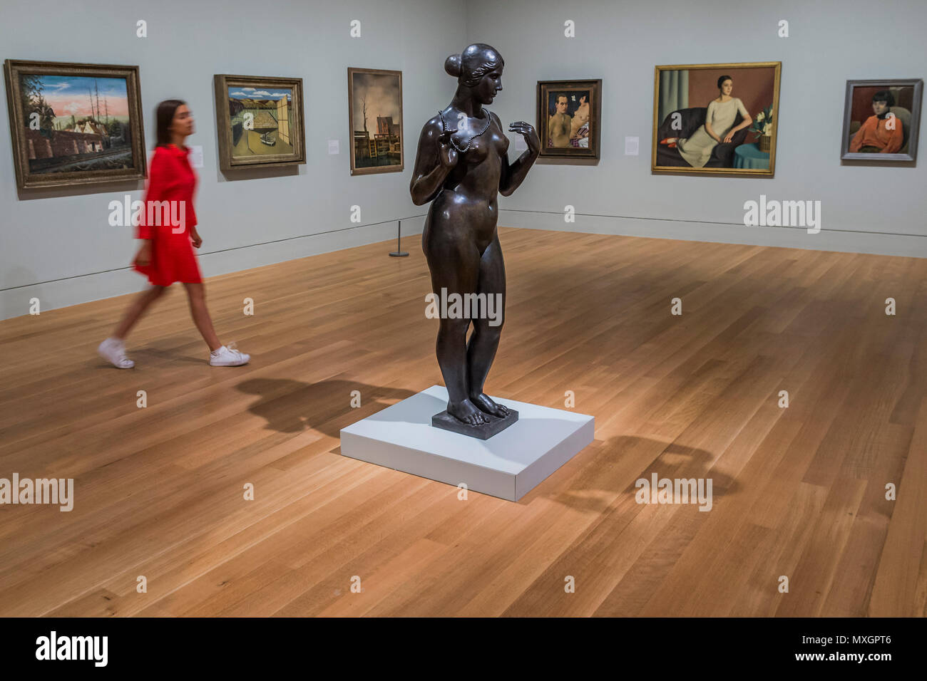 London, UK. 4th June, 2018. Venus with a Necklace, 1918-28 by Aristide Maillol and othe works in the Return to Order room - Aftermath: Art in the Wake of World War One is at Tate Britain. Marking 100 years since the end of the First World War, the exhibition explores the immediate impact of the conflict on British, German and French art, looking at how artists responded to the physical and psychological scars left on Europe, bringing to together over 150 works from 1916 to 1932. Credit: Guy Bell/Alamy Live News Stock Photo