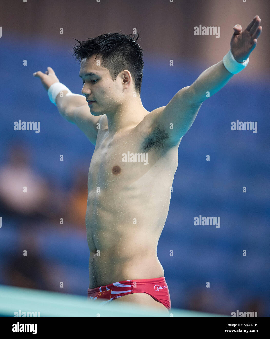 Wuhan, China's Hubei Province. 4th June, 2018. China's Qiu Bo competes during the men's 3m springboard competition of Mixed 3m&10m Team Final at the FINA Diving World Cup 2018 in Wuhan, central China's Hubei Province, on June 4, 2018. Team China claimed the title with a total of 406.20 points. Credit: Xiao Yijiu/Xinhua/Alamy Live News Stock Photo