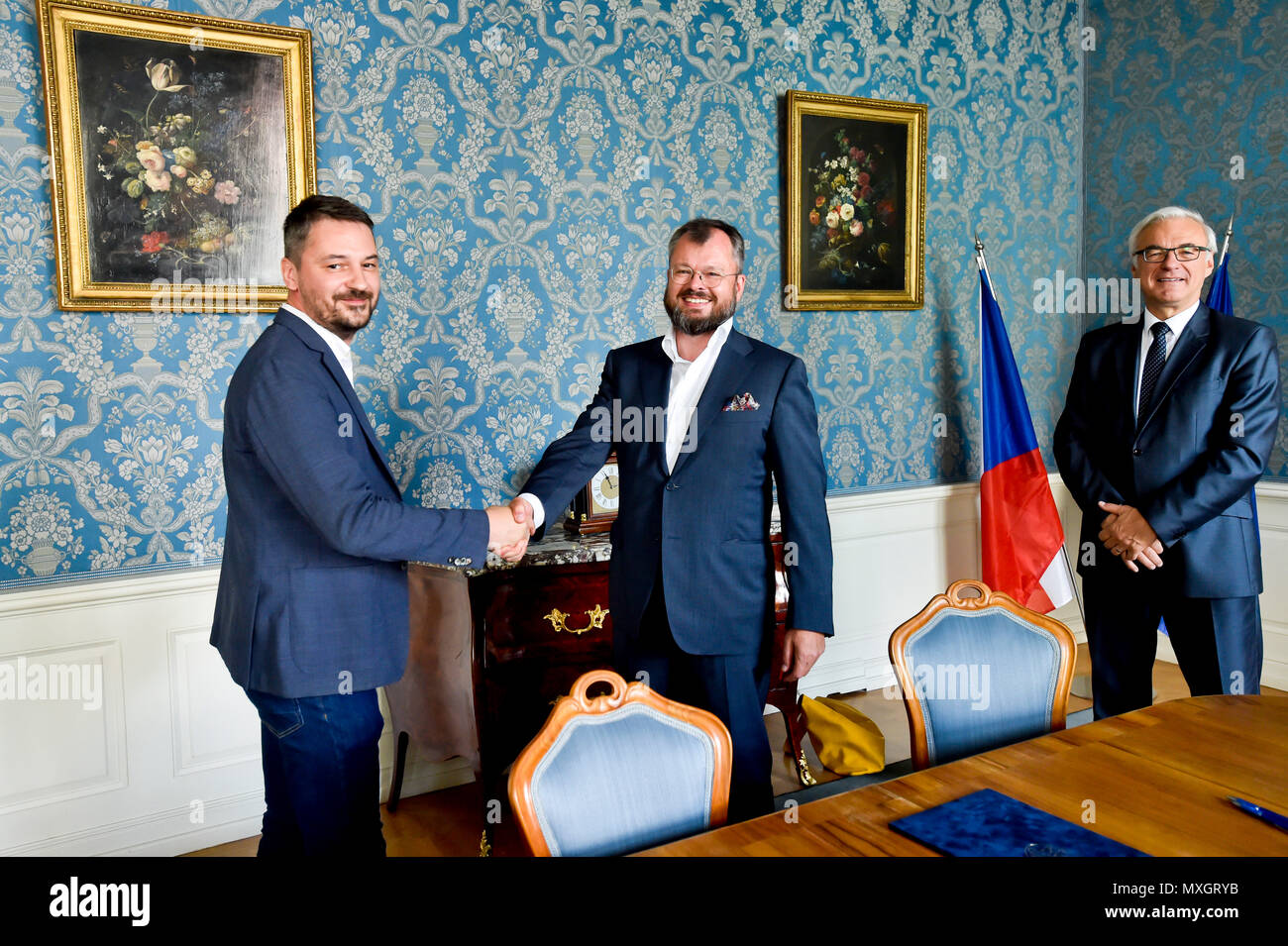 The National Film Archive (NFA) and the Film and Television School of the Academy of Performing Art (FAMU) in Prague made an agreement on the digitisation of Czech films today, on Monday, June 4, 2018. The agreement, signed by FAMU Dean Zdenek Holy, left, and NFA director Michal Bregant, guarantees that the digital restoration would be carried out in cooperation with the living film-makers, primarily the director, photographer and sound mixer, that their testimonies and expert opinions will be recorded. On the photo right there is Culture Minister Ilja Smid. (CTK Photo/Vit Simanek) Stock Photo