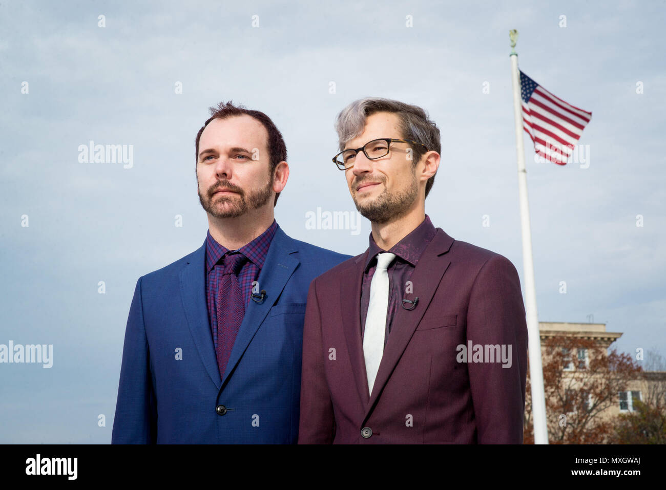 Washington, District of Columbia, USA. 5th Dec, 2017. CHARLIE CRAIG (L) and DAVID MULLINS stand outside the Supreme Court after oral arguments in Masterpiece Cakeshop v. Colorado Civil Rights Commission. The court ruled in favor of the baker who denied custom wedding cake work for Craig and Mullins. Credit: Erin Scott/ZUMA Wire/Alamy Live News Stock Photo