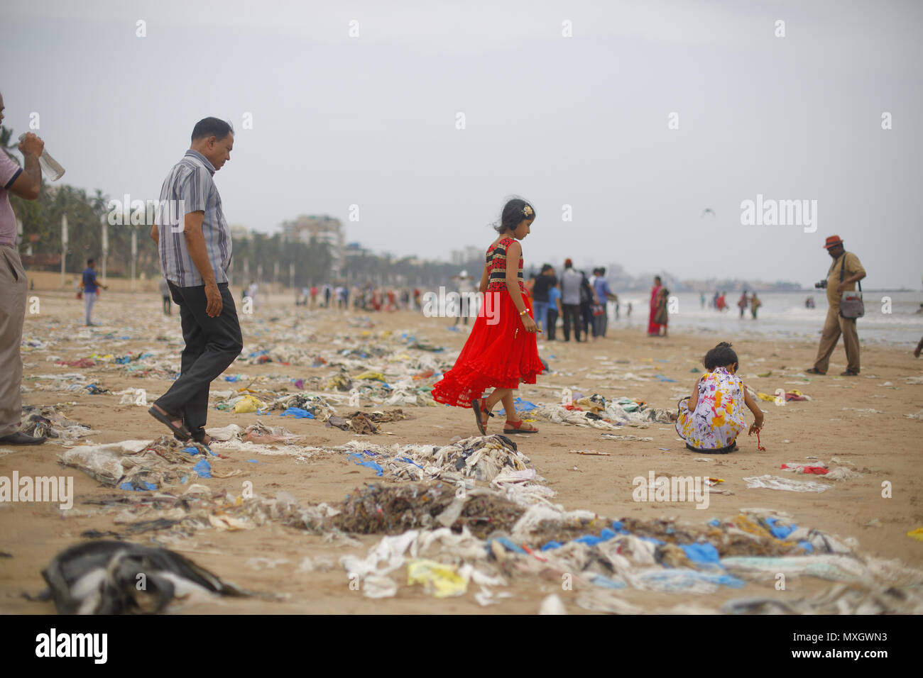 Mumbai, India. 3rd June, 2018. 03 June 2018, Juhu Beach - Mumbai : INDIA.Heaps of Plastic lie piled up at the Juhu Beach, a popular Beach Hangout place in Mumbai.everyday tonnes of Plastic waste gets washed ashore from the Arabian Sea.Our planet is drowning in plastic pollution.Today we produce about 300 million tonnes of plastic every year. That's nearly equivalent to the weight of the entire Human Population.Only 9% of all plastic waste ever produced has been recycled. About 12% has been incinerated, while the rest - 79% - has accumulated in landfills, dumps or the natural environmen Stock Photo