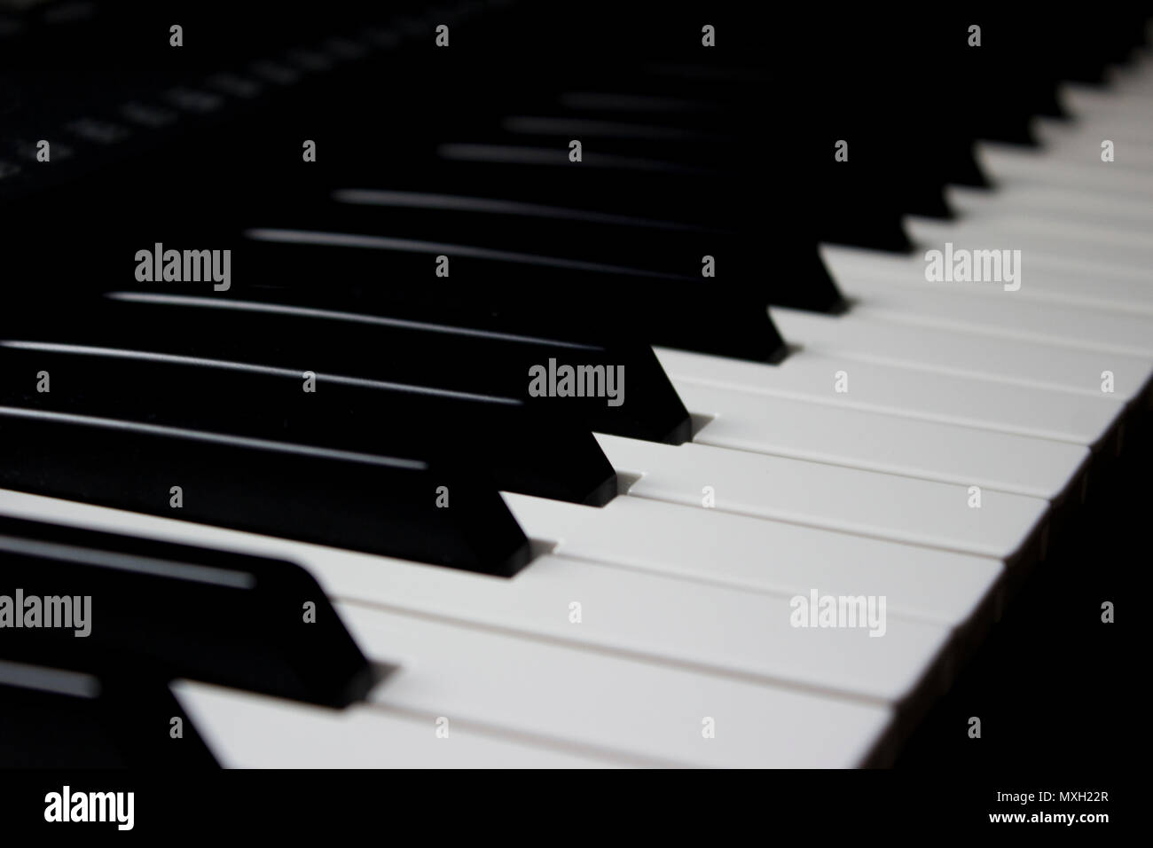 Piano keys standing still in a diagonal shot Stock Photo