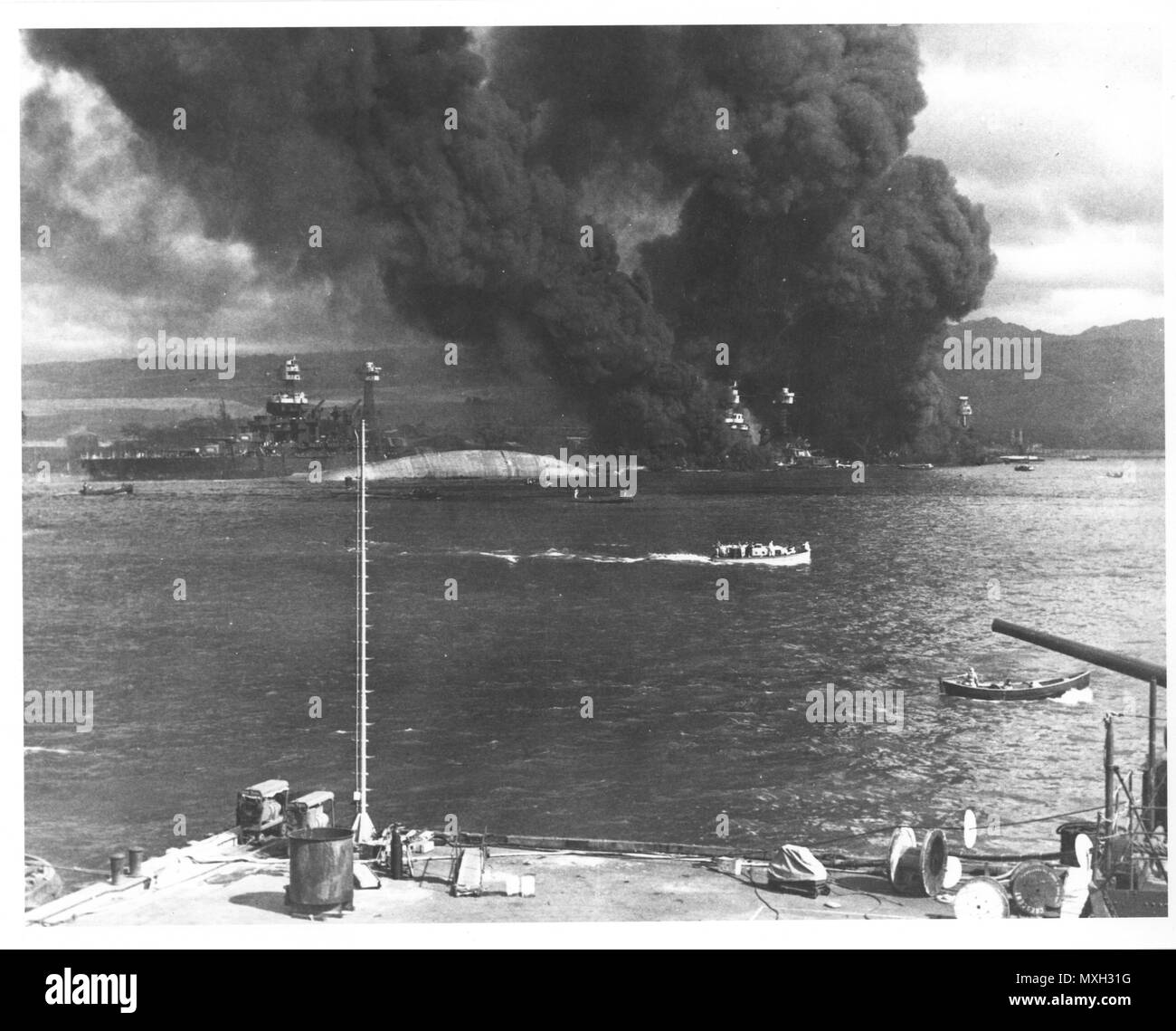 Original caption: Burning and damaged ships after the Japanese attack on Pearl Harbor, Dec. 7 1941. Photo courtesy of the U.S. National Archives and Records Administration. Stock Photo